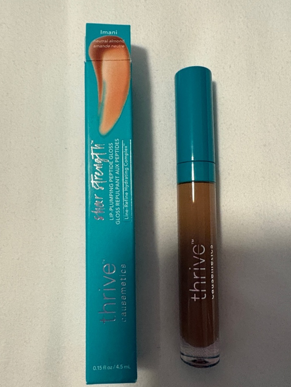 thrive causemetics Lip Plumping Gloss - Imani- A Neutral Almond Brown